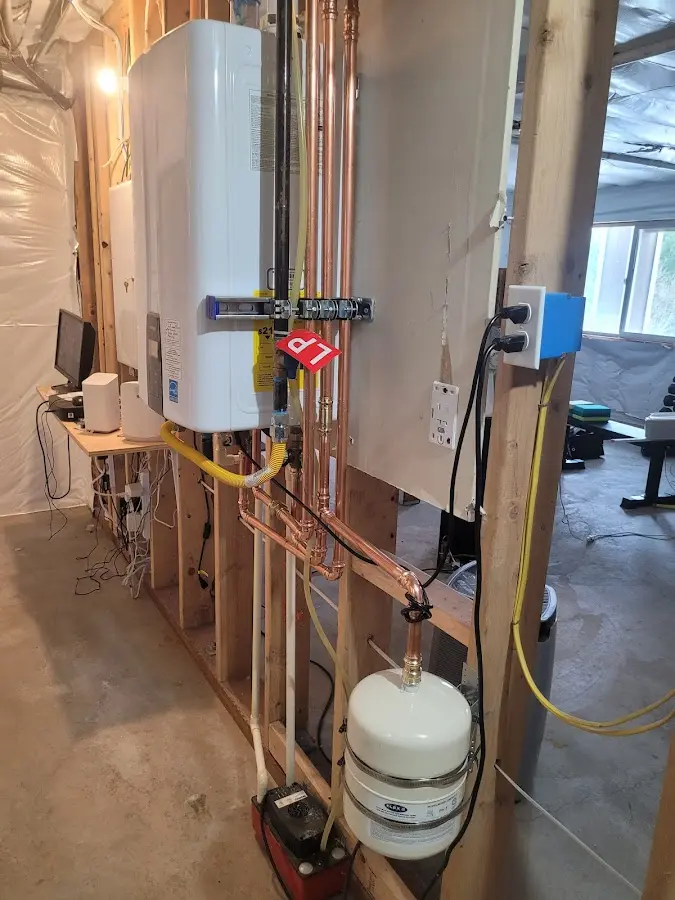 Licensed plumber repairing a kitchen sink in Whitehall